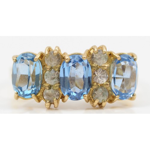 142 - A 9ct gold oval cut blue and white gemstone dress ring, O, 3.8g