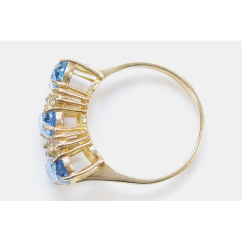 142 - A 9ct gold oval cut blue and white gemstone dress ring, O, 3.8g