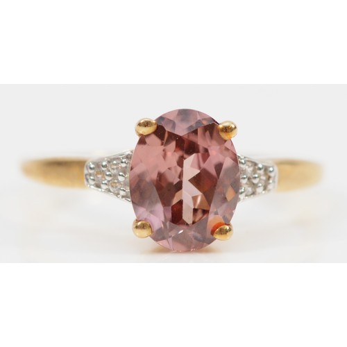 143 - A 9ct gold oval cut pink and white gemstone dress ring, O, 2.2g