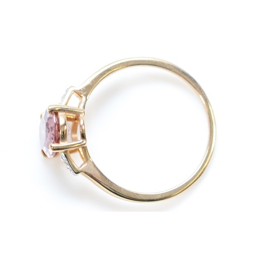 143 - A 9ct gold oval cut pink and white gemstone dress ring, O, 2.2g