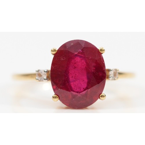 144 - A 9ct gold oval cut red and white gemstone dress ring, 11mm x 9mm gemstone, N, 3g