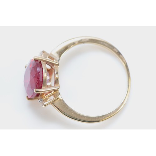 144 - A 9ct gold oval cut red and white gemstone dress ring, 11mm x 9mm gemstone, N, 3g