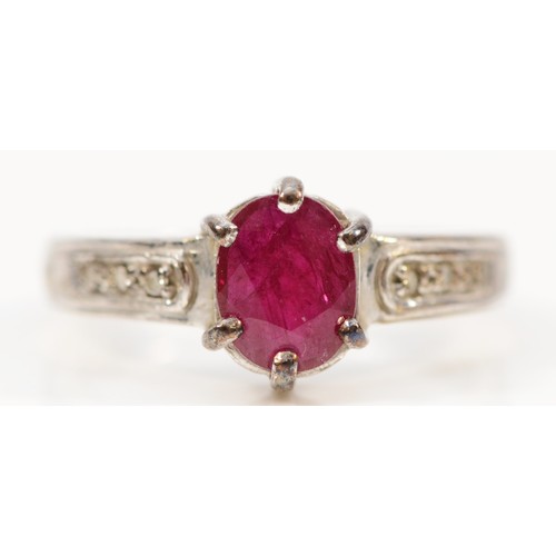 161 - A 9ct white gold glass filled ruby dress ring with diamond set shoulders, N, 3.6g