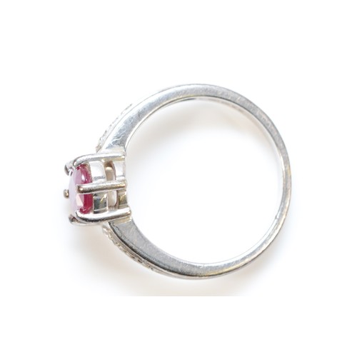 161 - A 9ct white gold glass filled ruby dress ring with diamond set shoulders, N, 3.6g