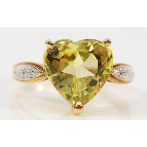 162 - A 9ct gold heart cut citrine dress ring with diamond set shoulders, N, 3.3g