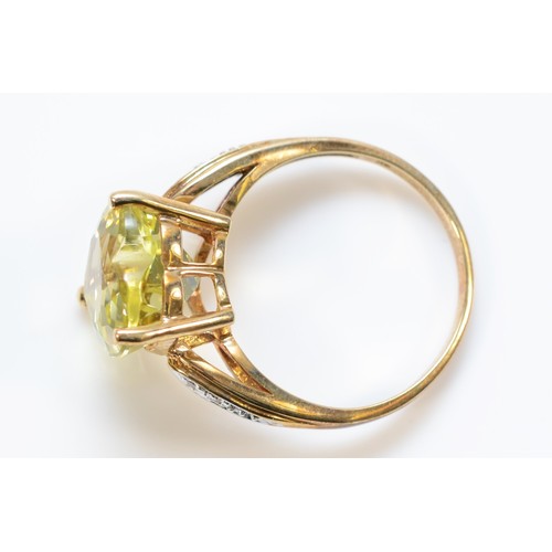 162 - A 9ct gold heart cut citrine dress ring with diamond set shoulders, N, 3.3g