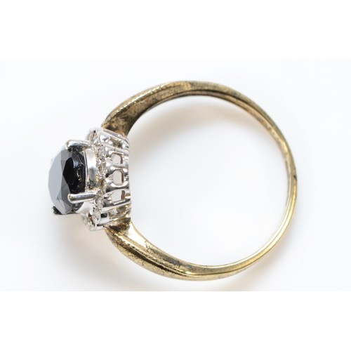 176 - A 9ct gold vintage diamond and hematite halo dress ring, P, 3.3g