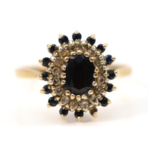 178 - A 9ct gold vintage sapphire and clear gemstone cluster ring, London 1988, O, 2.6g