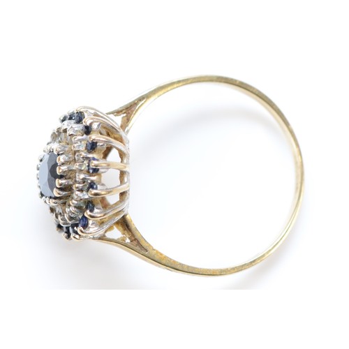 178 - A 9ct gold vintage sapphire and clear gemstone cluster ring, London 1988, O, 2.6g