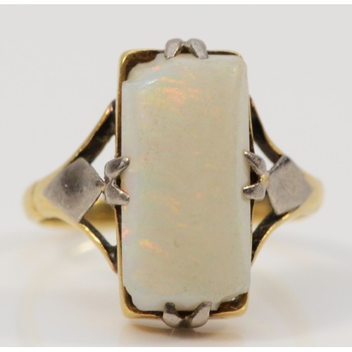 179 - A 9ct gold opal dress ring, 13mm x 7mm opal, F 1/2, 2.9g, chip to one corner