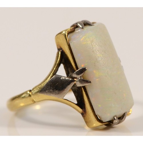 179 - A 9ct gold opal dress ring, 13mm x 7mm opal, F 1/2, 2.9g, chip to one corner