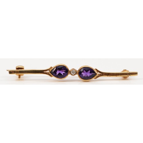 187 - A 9ct gold pear cut amethyst and diamond bar brooch, 50mm across, 2.4g