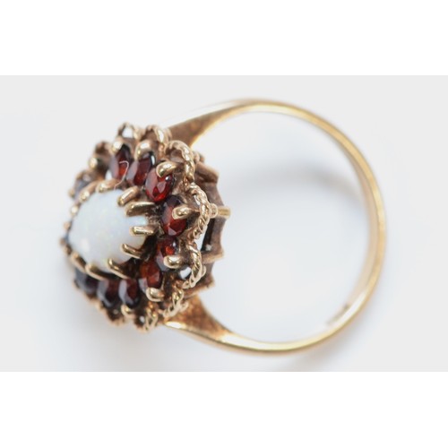 188 - A 9ct gold vintage marquise opal and garnet oval cluster ring, one garnet missing, K 1/2, 4.1g