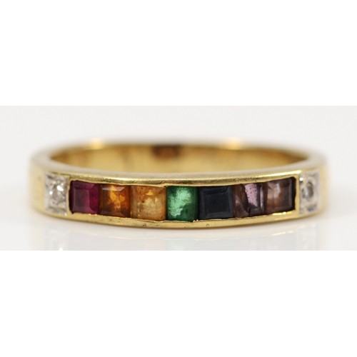 192 - A 14K gold multi gemstone channel set ring, gemstones include diamond, ruby, citrine, emerald, sapph... 