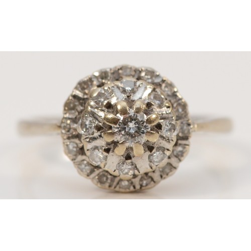 193 - An 18ct white gold vintage diamond cluster ring, N 1/2, 3.9g