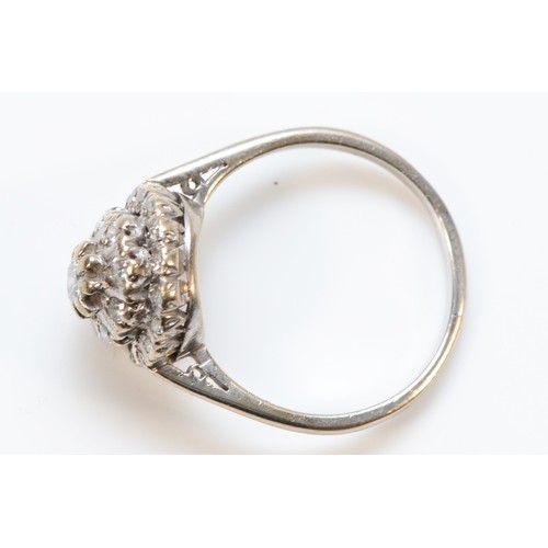 193 - An 18ct white gold vintage diamond cluster ring, N 1/2, 3.9g