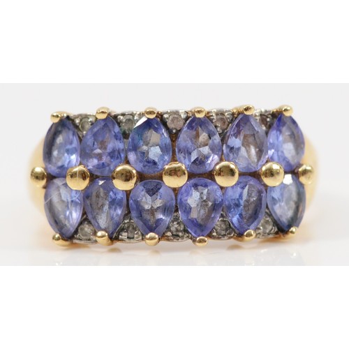 196 - A 9ct gold tanzanite and diamond double row half eternity ring, L, 3.6g