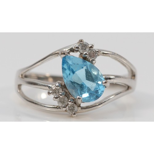 197 - A 9ct white gold pear cut blue topaz and diamond dress ring, N, 3.3g