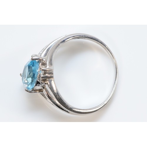 197 - A 9ct white gold pear cut blue topaz and diamond dress ring, N, 3.3g