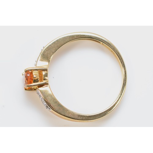 199 - A 9ct gold citrine solitaire dress ring with diamond set shoulders, N, 2.7g