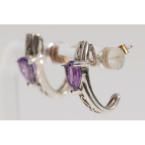 230 - A pair of 9ct white gold pear cut amethyst drop earrings with scroll backs, 16mm drop, 2.9g