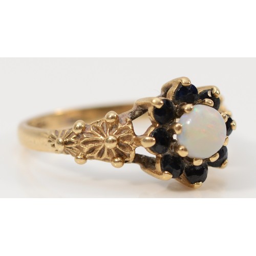 269 - A 9ct gold opal and sapphire floral cluster ring, Birmingham 1980, 2.4g