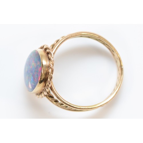 296 - A 9ct gold opal triplet ring, M 1/2, twisted rope detail, 3.7g