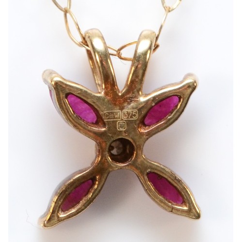 304 - A 9ct gold ruby and diamond floral pendant with chain, 1g