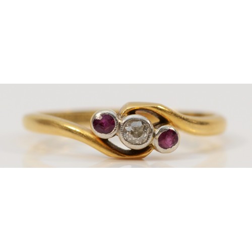 553 - An 18ct gold and platinum ruby and old cut diamond three stone ring, L, 2.1g