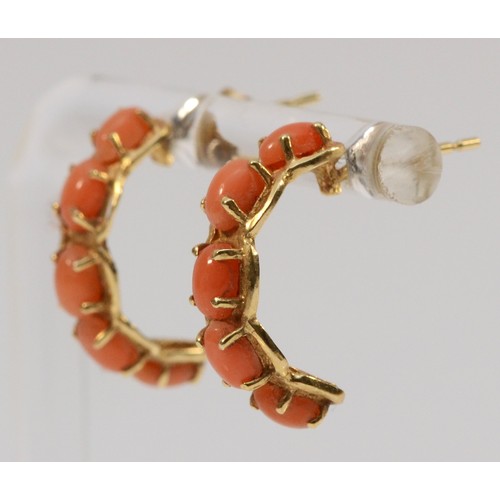 559 - A pair of 14K gold coral half hoop earrings with scroll backs, 18mm drop, 3.3g