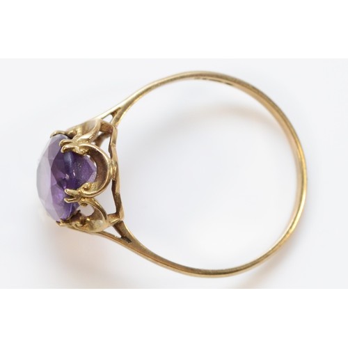 563 - A 9ct gold amethyst dress ring, 10mm x 7mm amethyst, Q 1/2, 1.9g