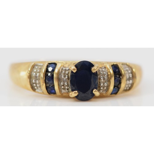 564 - A 9ct gold sapphire and diamond ring, O, 1.8g