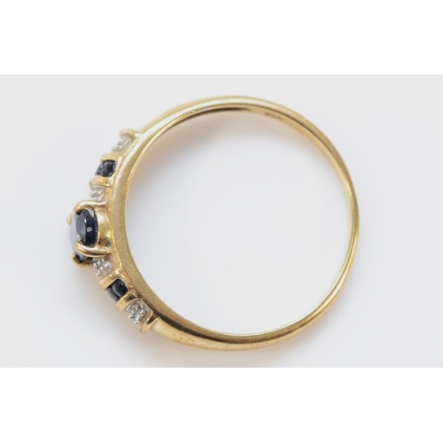 564 - A 9ct gold sapphire and diamond ring, O, 1.8g