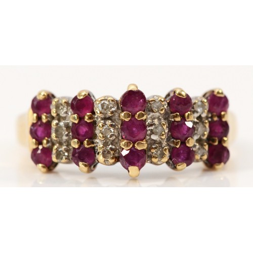 571 - A 9ct gold ruby and diamond three row ring, N, 2.3g