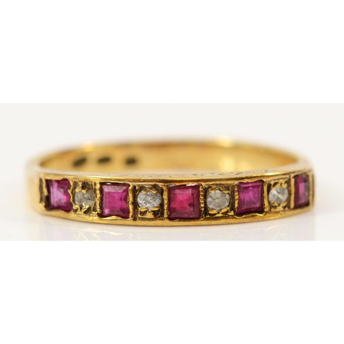 573 - A 9ct gold ruby and brilliant cut diamond half eternity ring, M, 1.7g