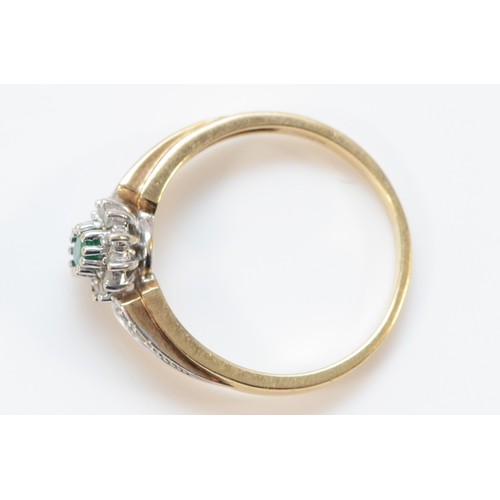 576 - A 9ct gold emerald and diamond cluster ring, with diamond set shoulders, Q 1/2, 2.8g