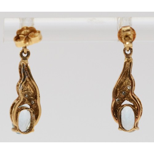 579 - A pair of 9ct gold blue topaz and diamond drop earrings with scroll backs, 23mm drop, 1.7g