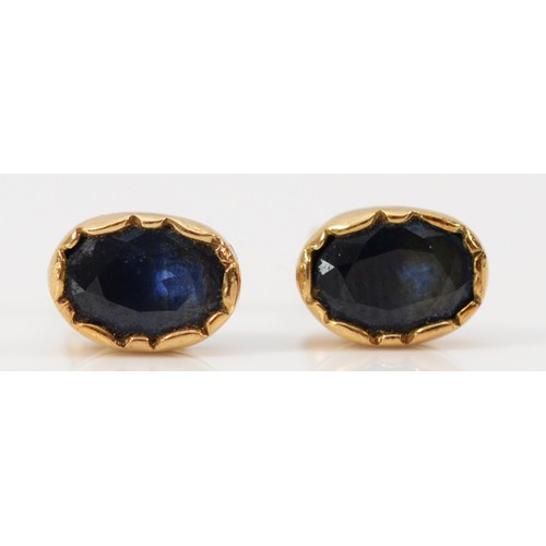 584 - A pair of 9ct gold sapphire stud earrings with scroll backs, 6mm, 1.1g