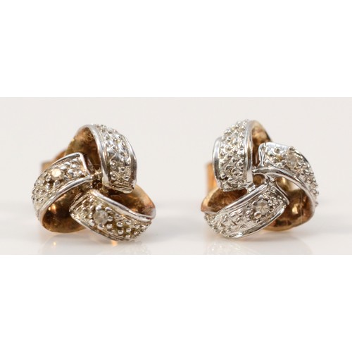 585 - A pair of 9ct gold diamond knot design earrings with scroll backs, 8mm diameter, 1.6g