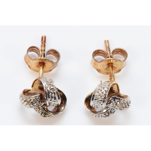 585 - A pair of 9ct gold diamond knot design earrings with scroll backs, 8mm diameter, 1.6g