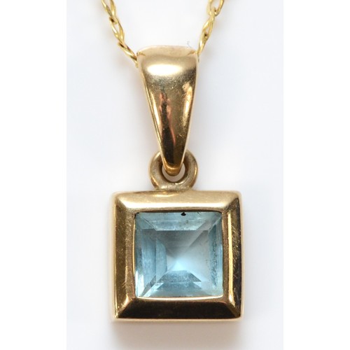 588 - A 9ct gold blue topaz pendant with chain, 9mm square pendant, 2.4g