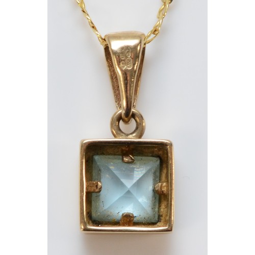 588 - A 9ct gold blue topaz pendant with chain, 9mm square pendant, 2.4g