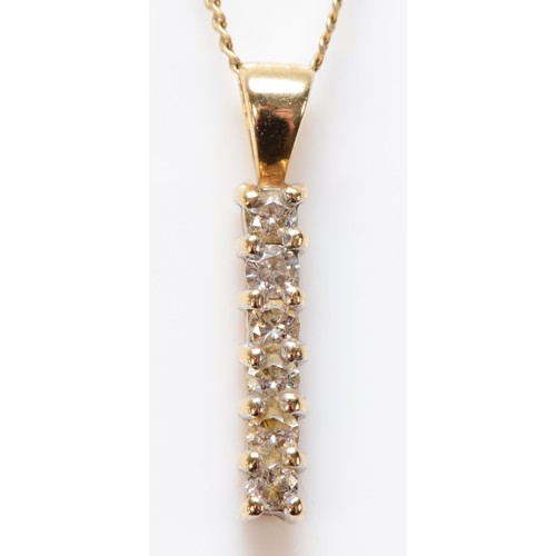 590 - A 9ct gold six brilliant cut diamond pendant on a chain, 15mm total pendant length, 1.3g