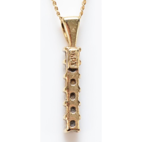 590 - A 9ct gold six brilliant cut diamond pendant on a chain, 15mm total pendant length, 1.3g