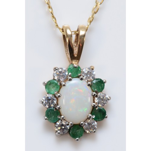 592 - A 9ct gold opal white gemstone and emerald pendant on a chain, 15mm pendant, 2.6g