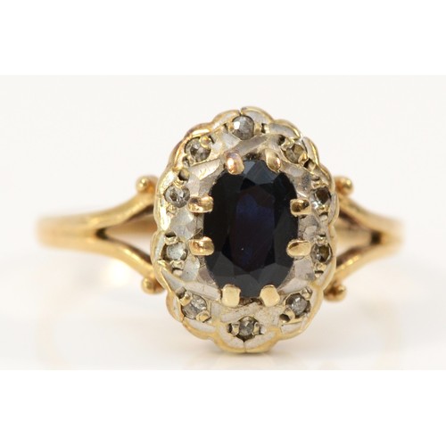 595 - A 9ct gold sapphire and diamond cluster ring, Birmingham 1985, 12mm ring front, L, 2.3g