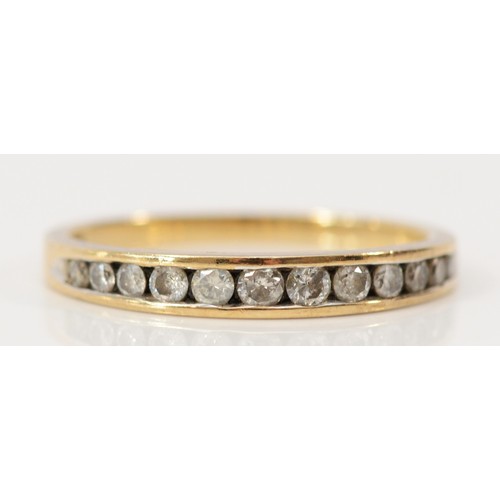 596 - A 9ct gold diamond channel set half eternity ring, brilliant cut diamonds, J, 1.2g