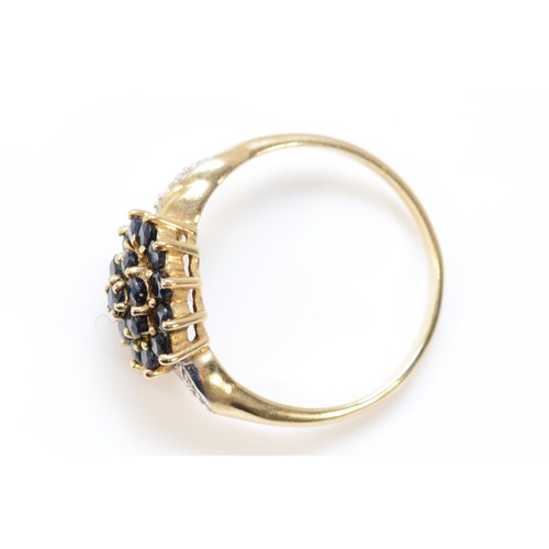 599 - A 9ct gold sapphire cluster ring with diamond set shoulders, 10mm ring front, P, 2.5g