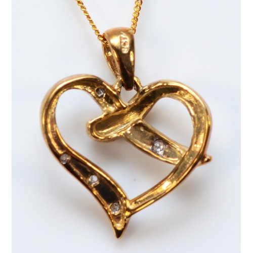 600 - A 9ct gold diamond heart shaped pendant with chain, 15mm across, 1.3g