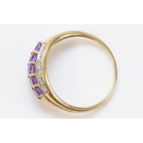 602 - A 9ct gold amethyst and diamond three row ring, U, 2.5g